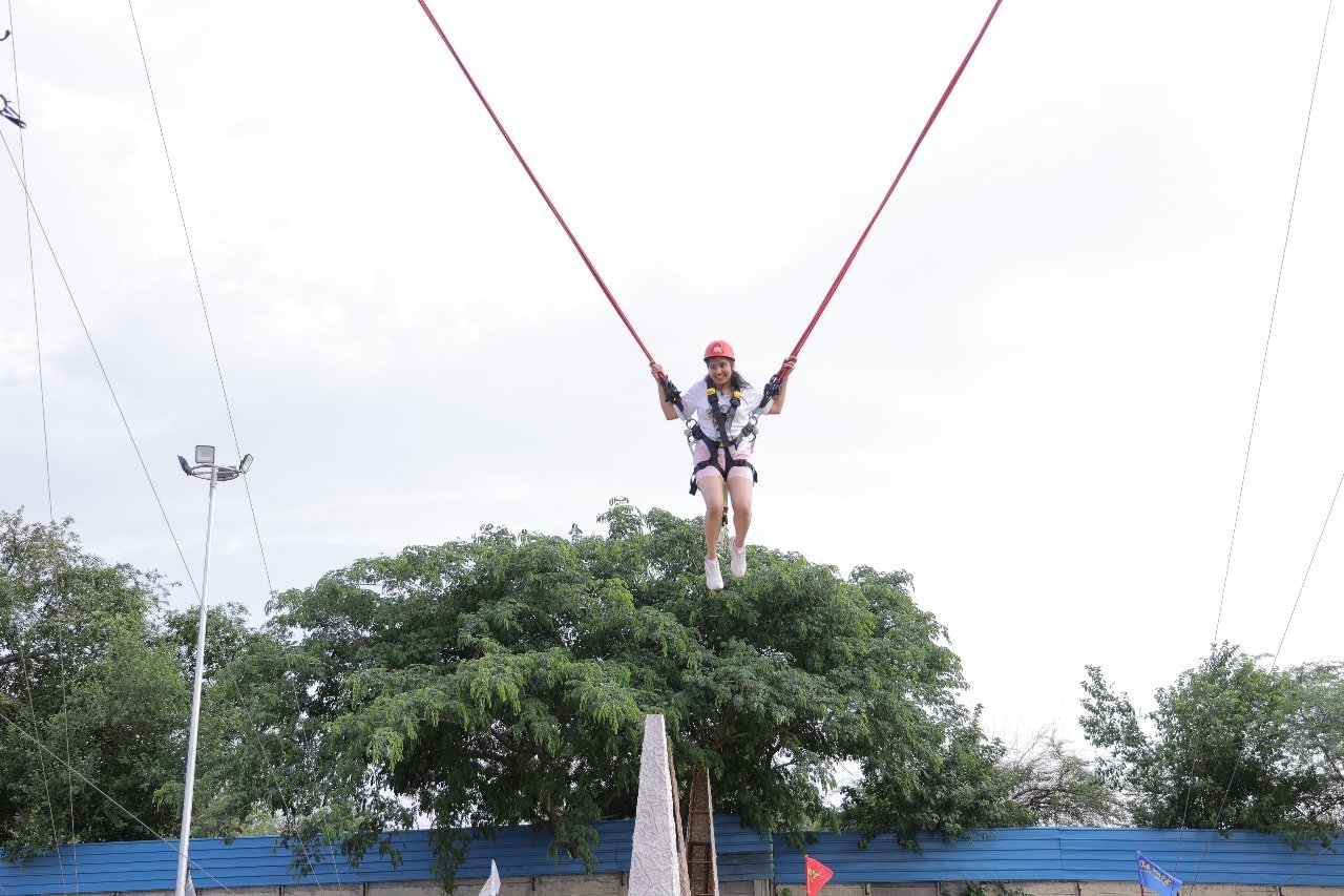 Guest mid-air on the bungee ejection in the Sky High Zone at Elevate